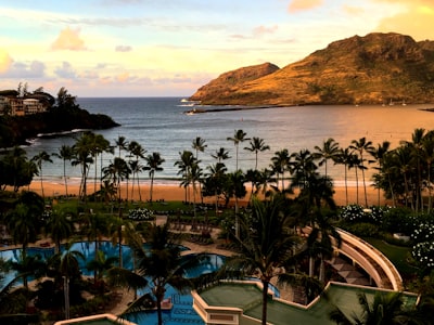 rock formation near body of water during daytime maui teams background