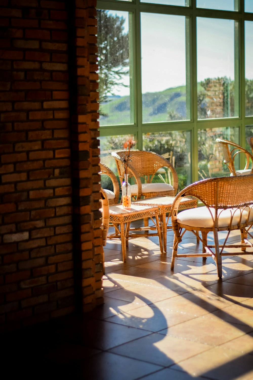 rattan chairs near wall