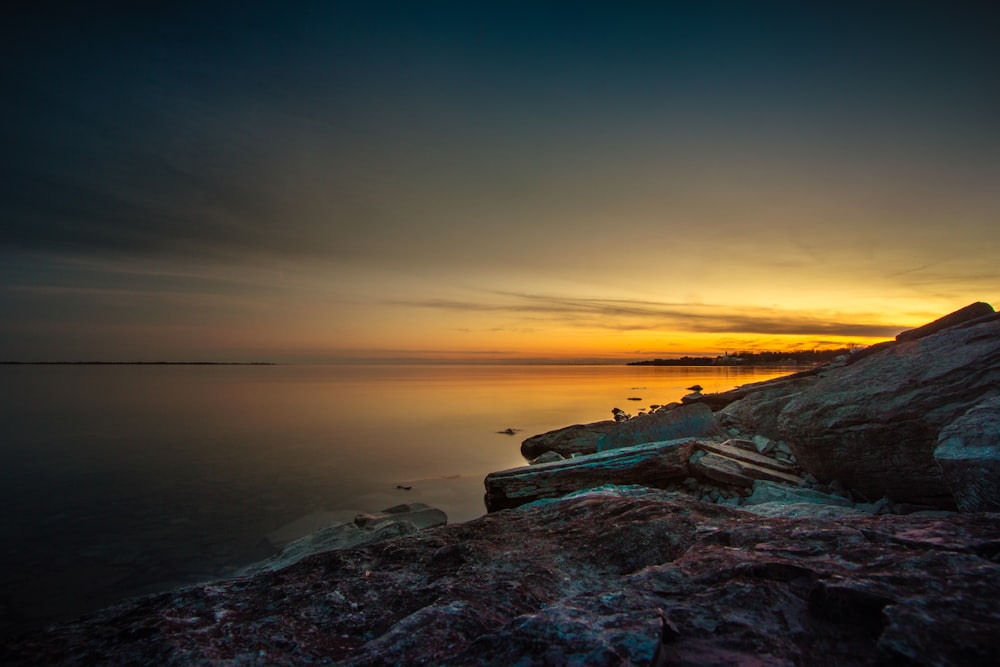 landscape photography of ocean during golden hour