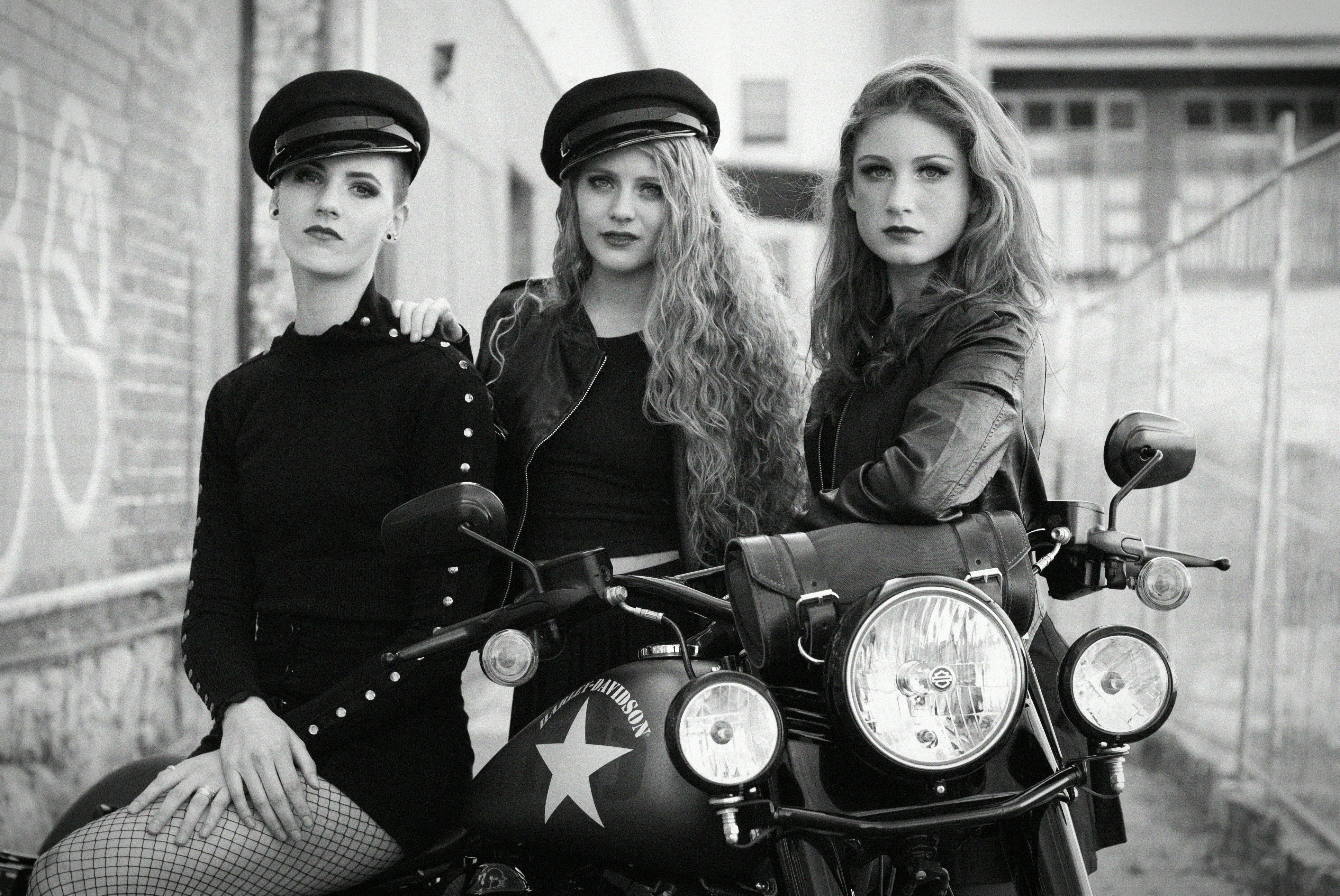 three women near motorcycle