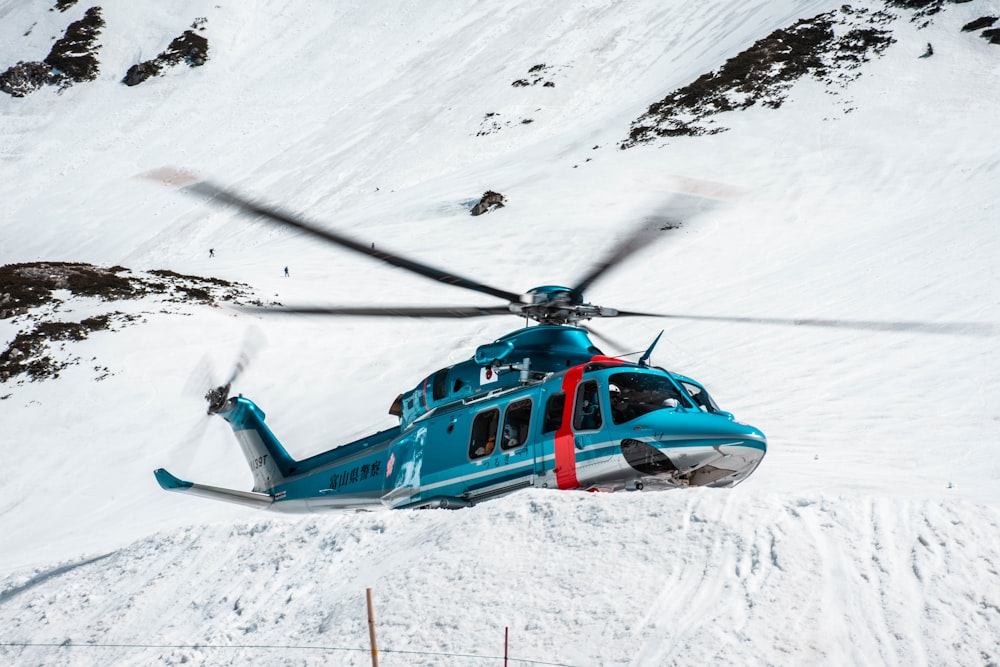 blue plane near mountain