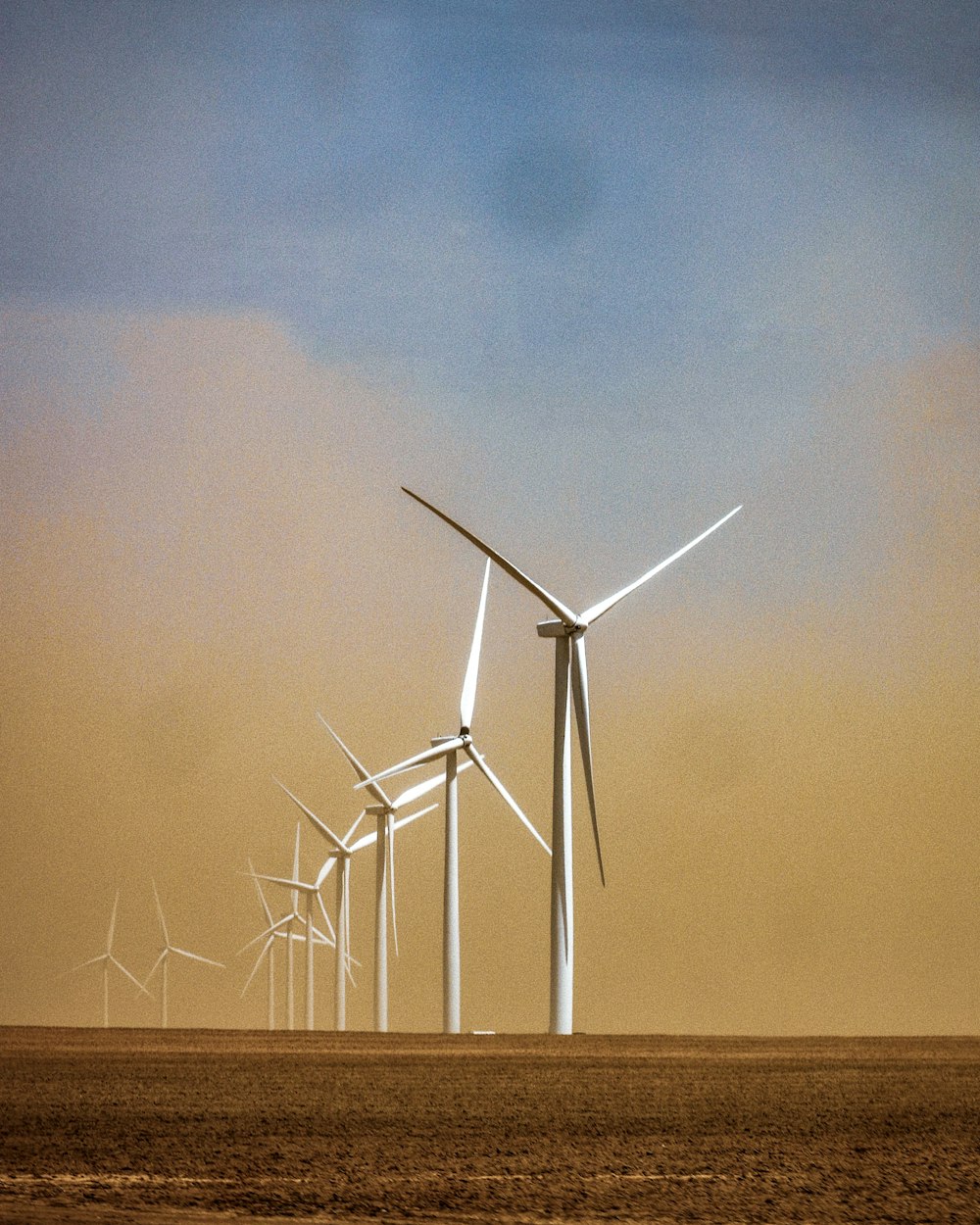 white wind turbine lot