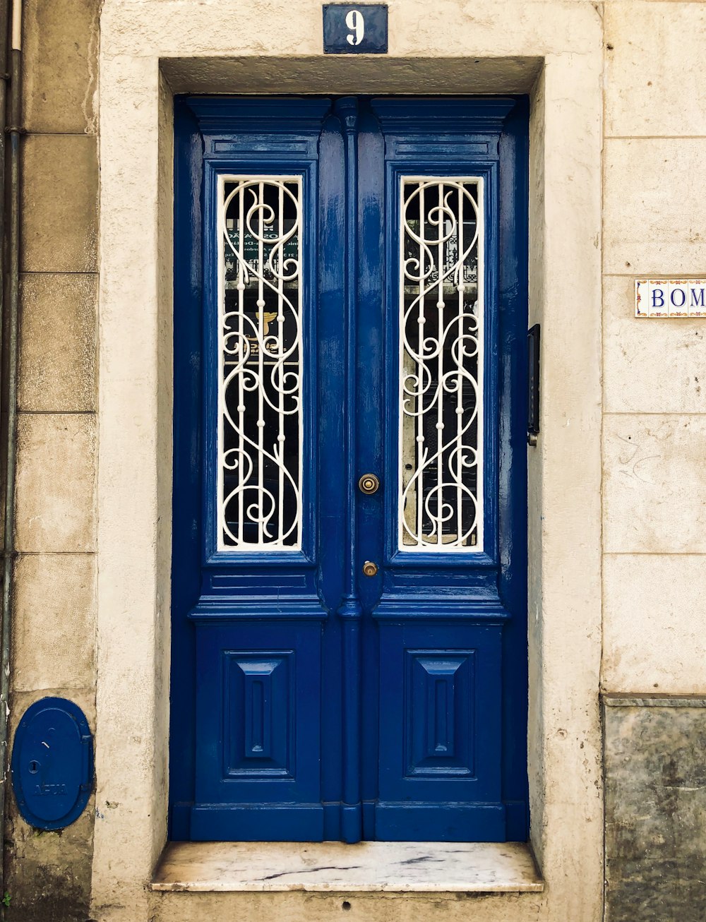 closed blue wooden doors