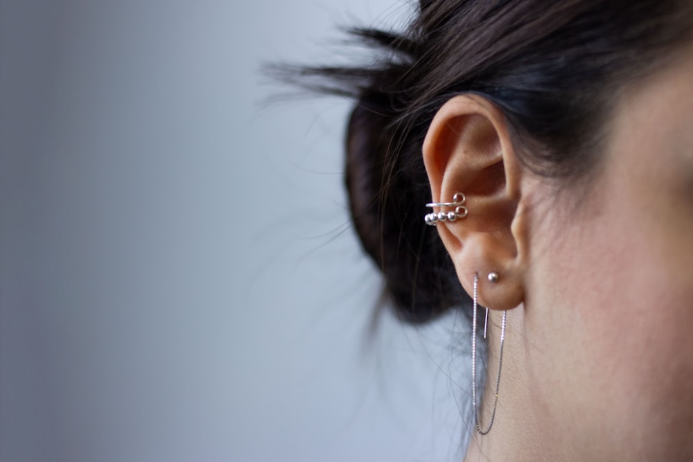 silver-colored earrings