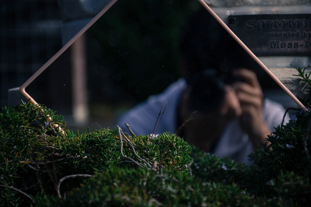 person taking photo in mirror