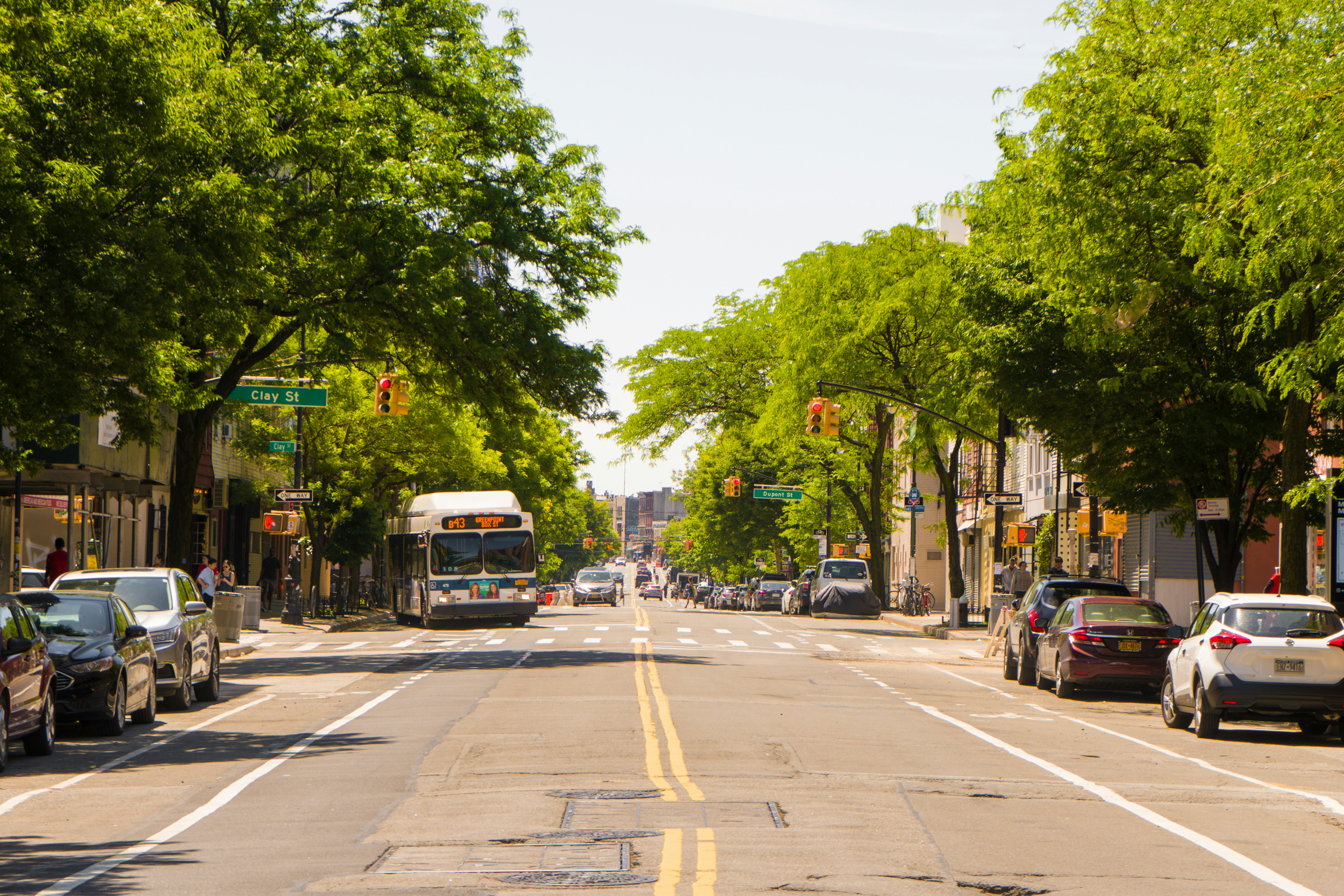 vehicles parked on side of road during daytime