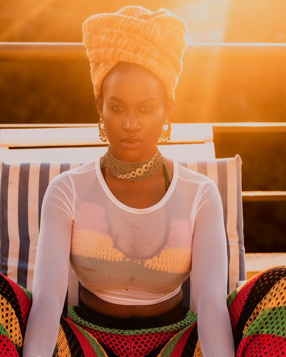 woman wearing white long-sleeved top and brown turban