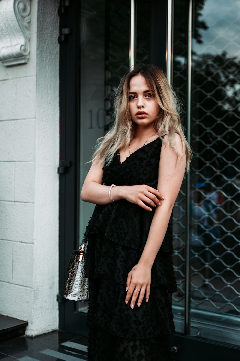 woman wearing black sleeveless dress