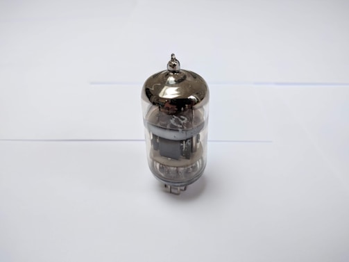 Side view of an eb-sources evaporation source mounted inside a vacuum chamber, highlighting its compact design.