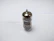 Close-up of a vintage-style vacuum tube glowing warmly inside a sleek steel chassis preamp.