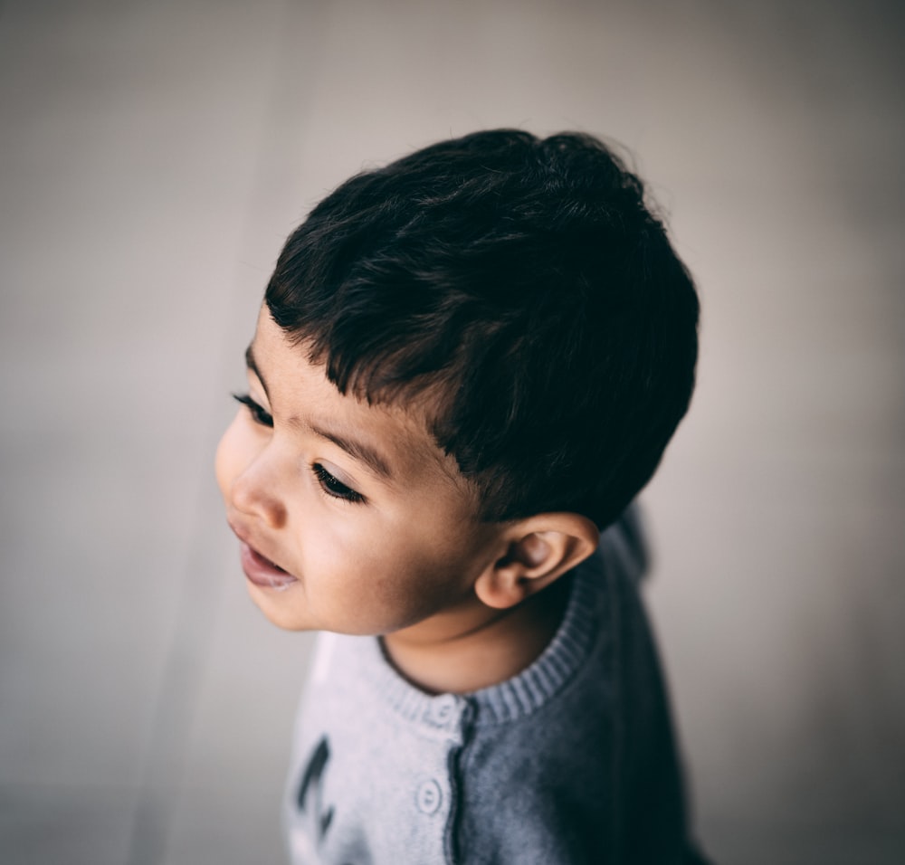 kid smiling close-up photography