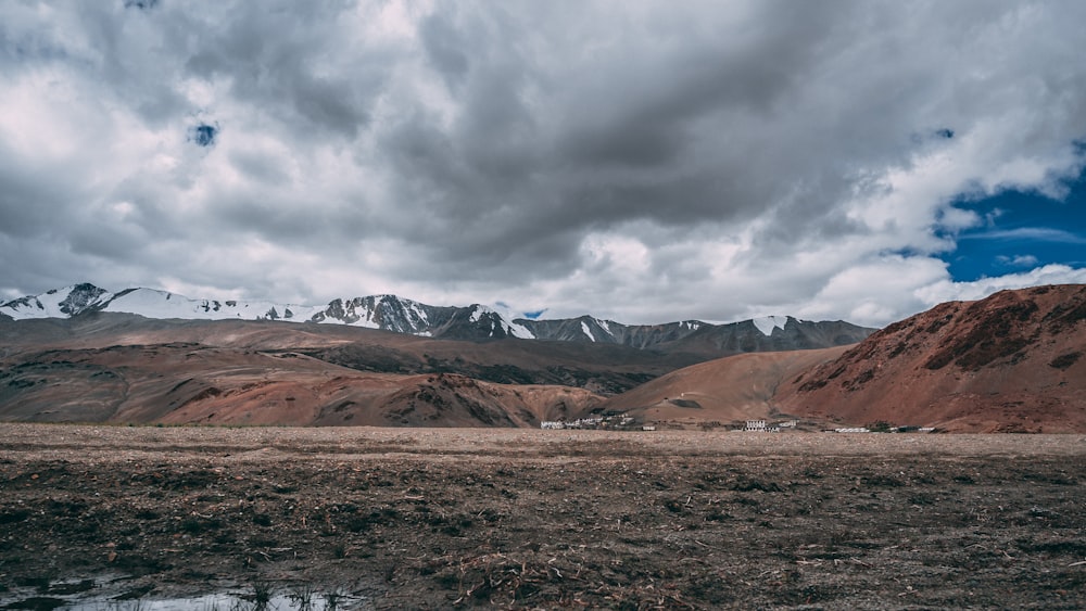 view of valleys under dark clouds