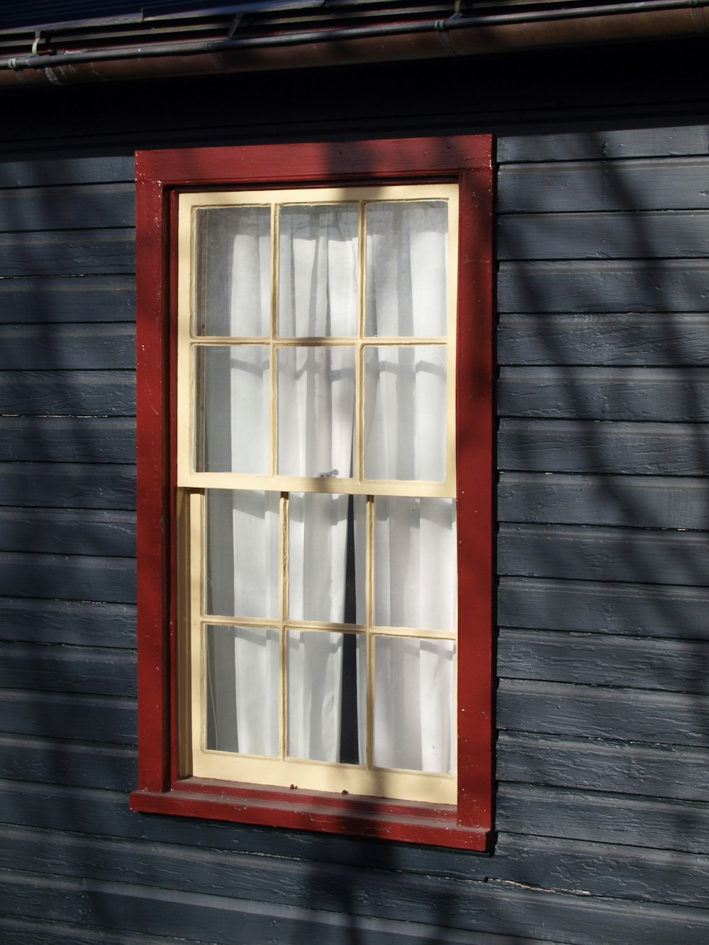 white and red French window frame