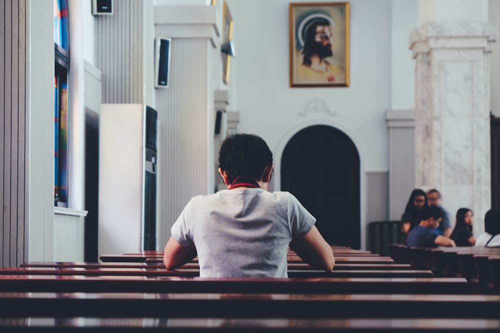 person praying inside church