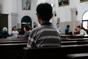 person sitting inside church