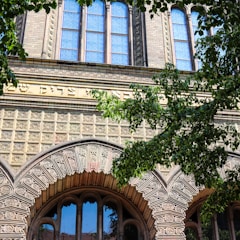 Facade of a boutique building showcasing stone and wood elements in Jerusalem.