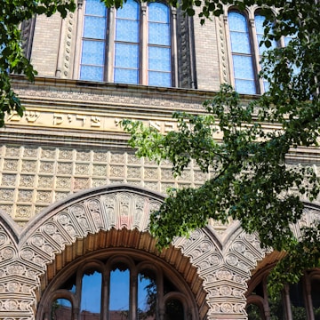 Facade of a boutique building showcasing stone and wood elements in Jerusalem.