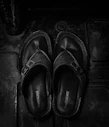 pair of black leather sandals