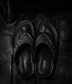 pair of black leather sandals