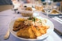 round white ceramic plate with fried foods