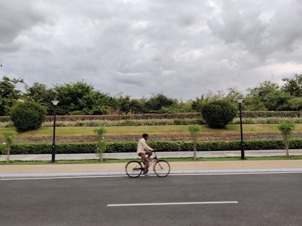 unknown person driving bicycle on road