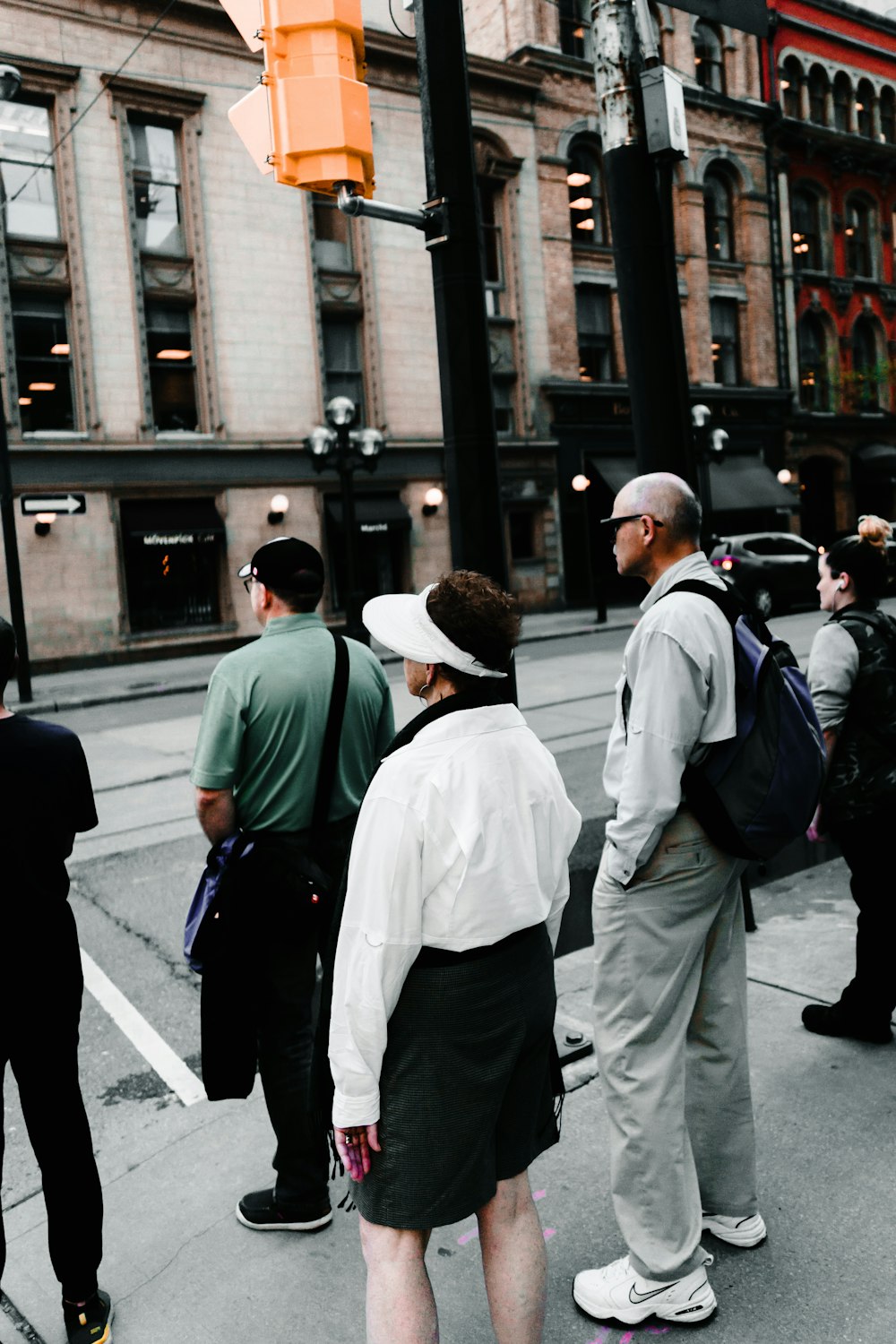 unknown persons standing outdoors