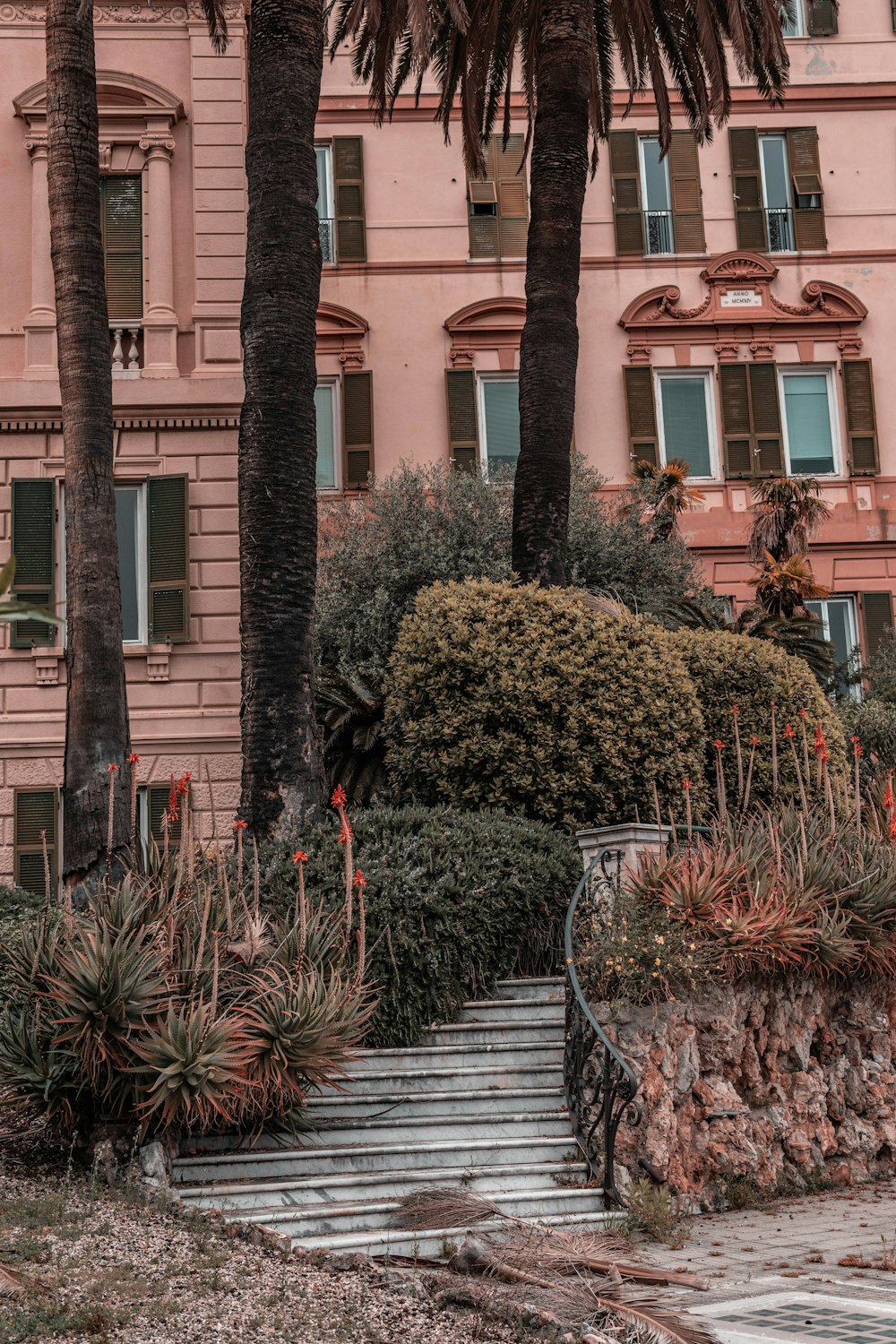 gray staircase besides green plants