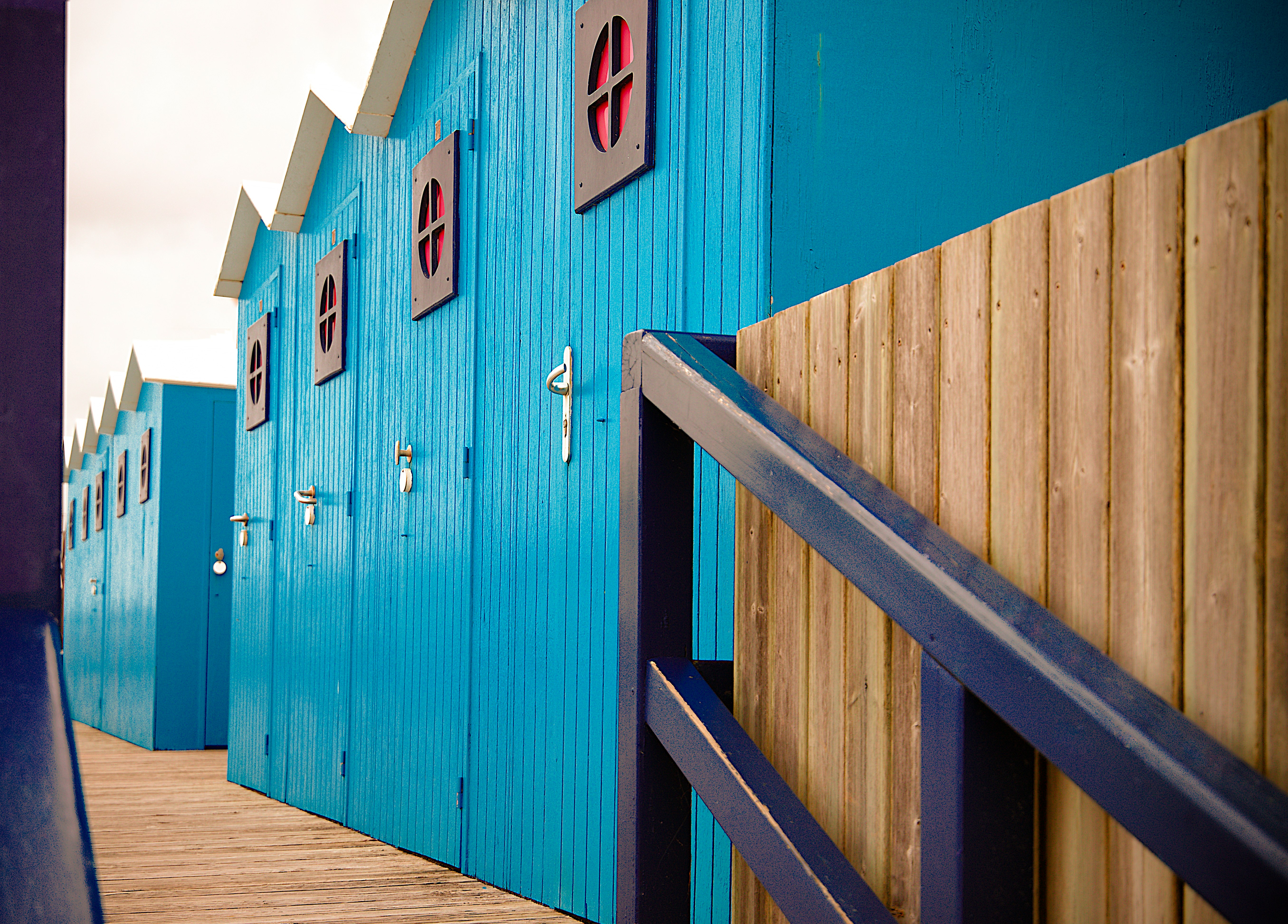 blue wooden sheds