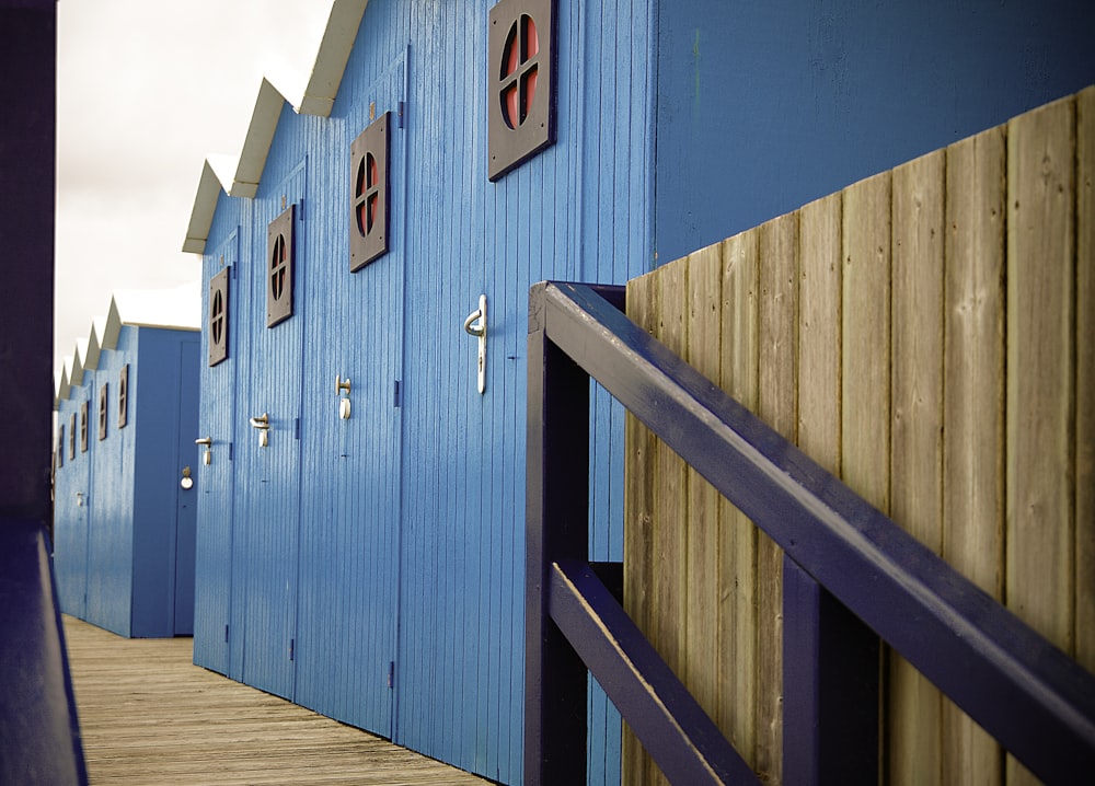 blue wooden sheds