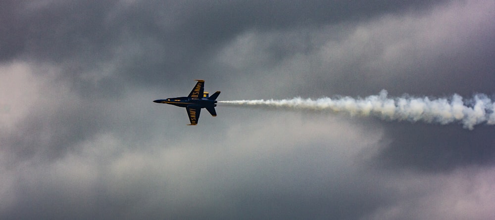 black jet plane on flight