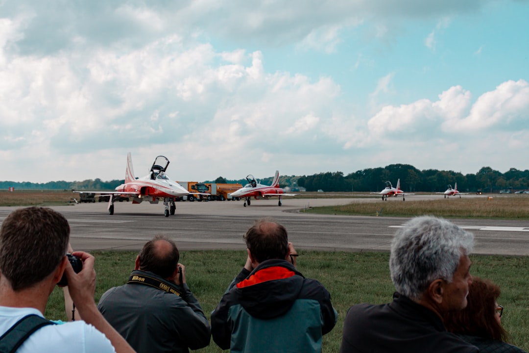 people near airplanes,