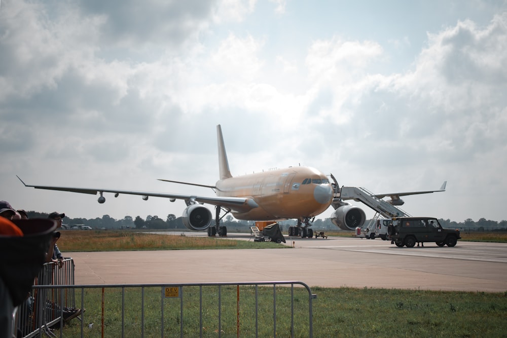 photo of orange and white airliner