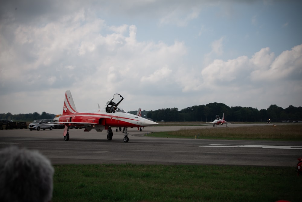 red and white jet plane