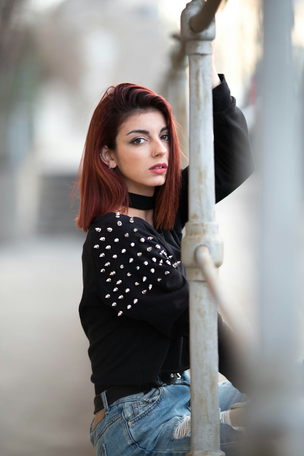 woman sitting on fence