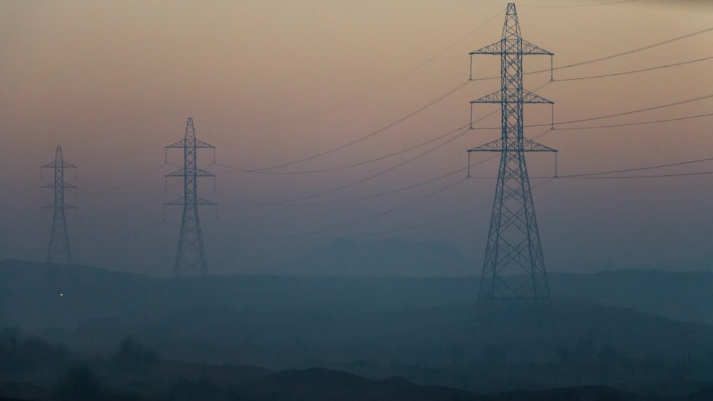 electrical towers during golden hour