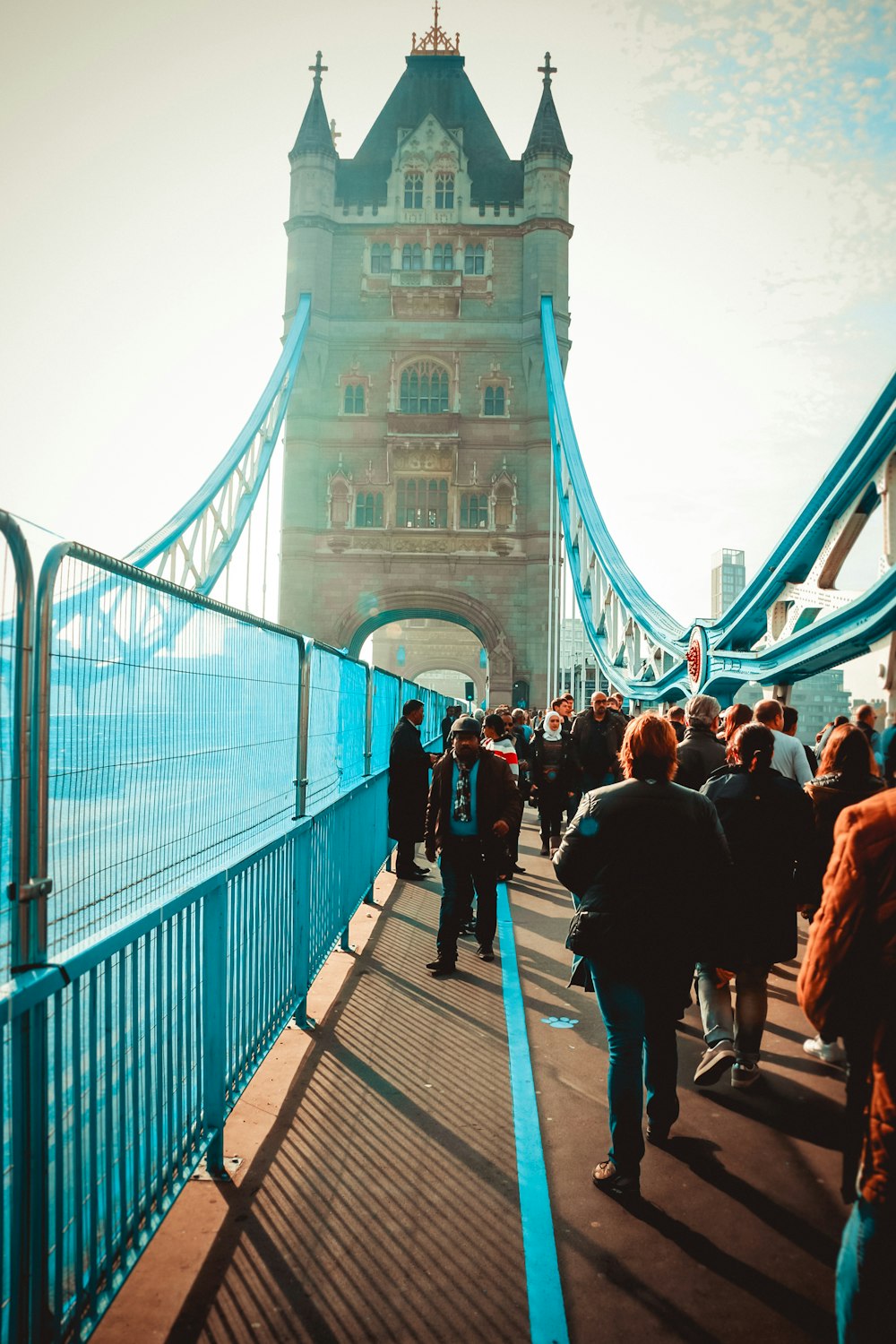group of people walking on bridge during daytime