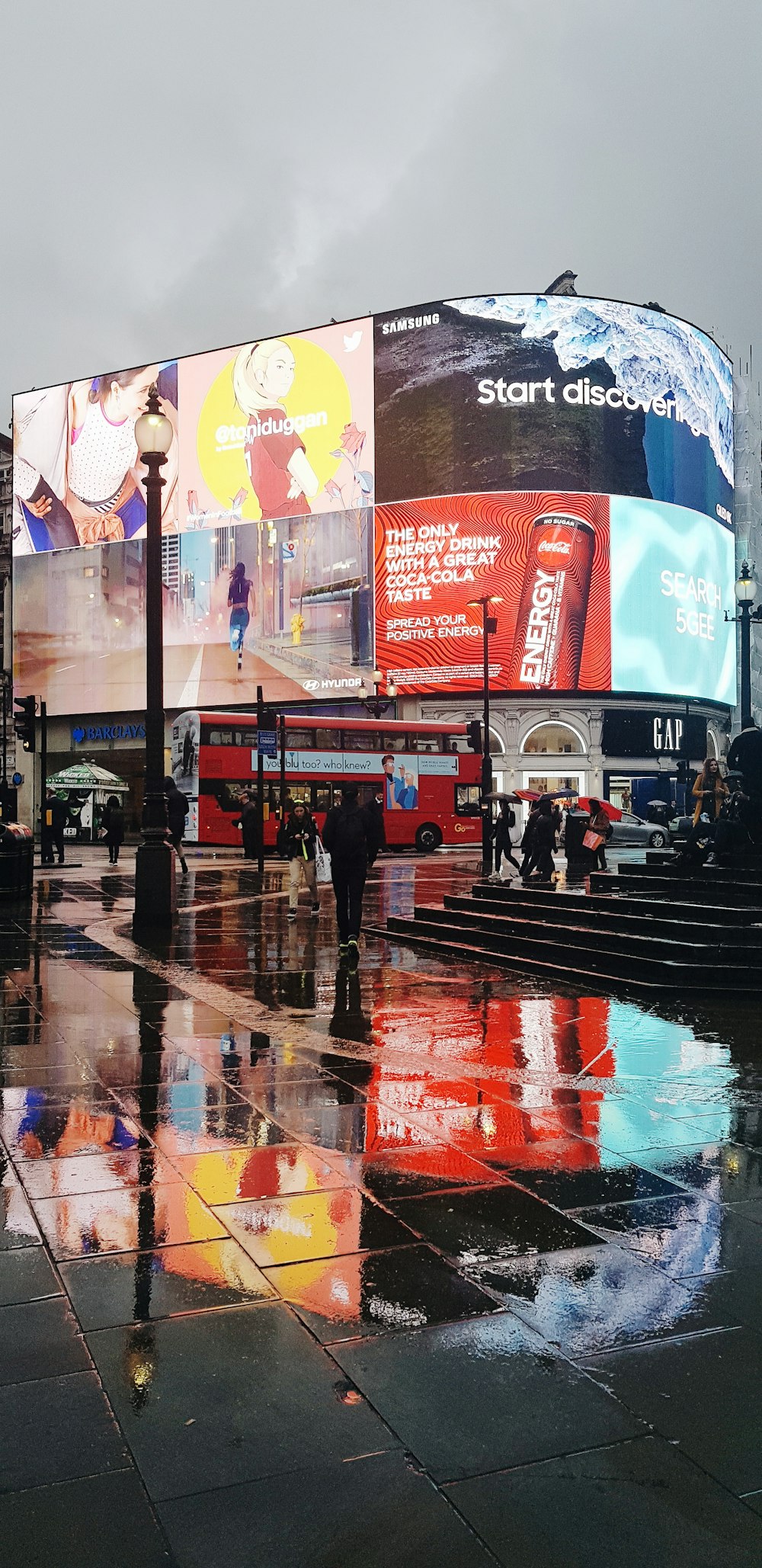 a big building with a lot of billboards on it