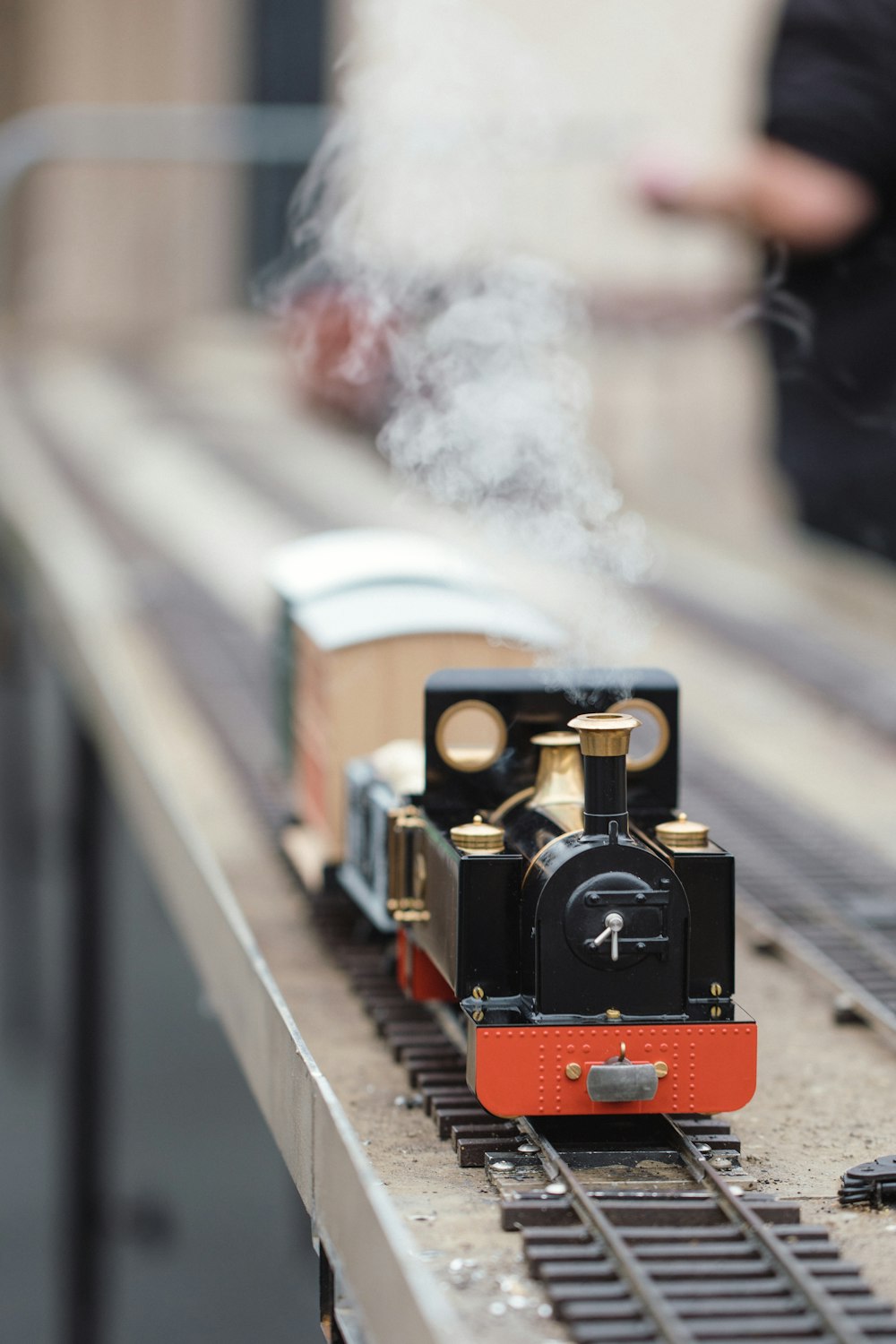 selective focus photography of red and black train die-cast