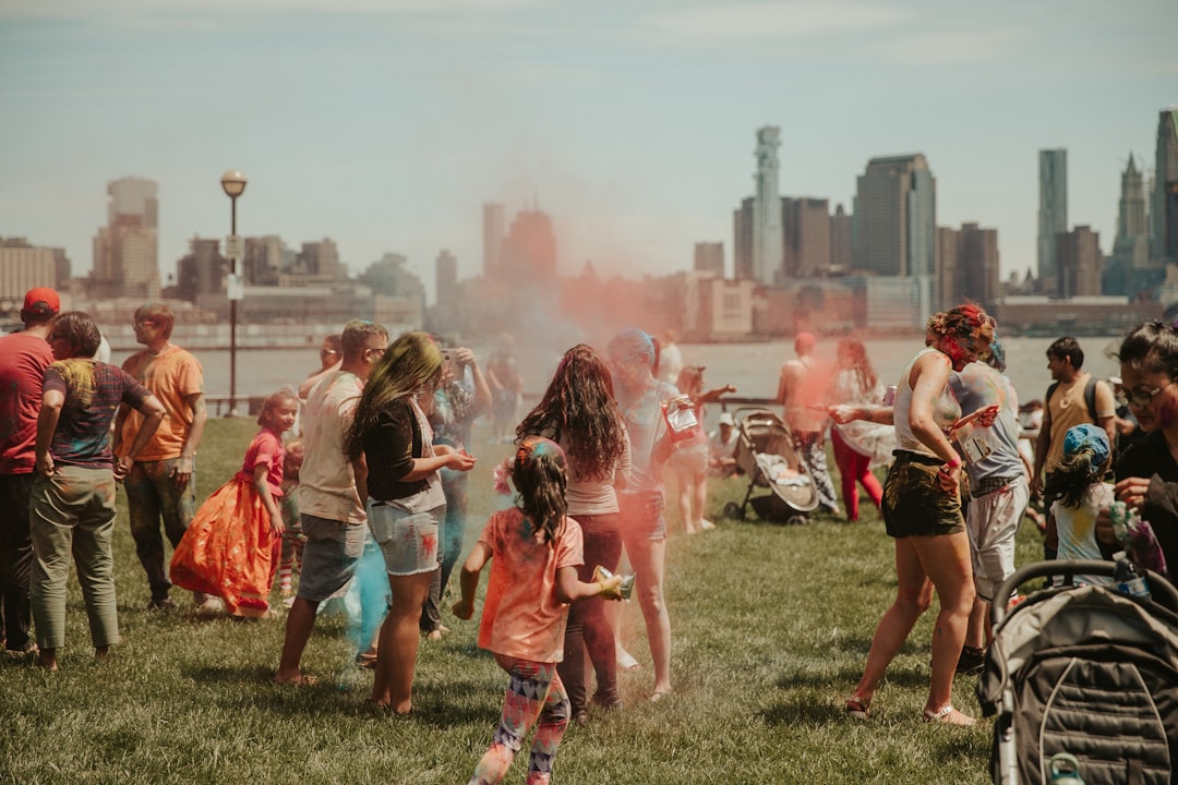 people standing with color powders