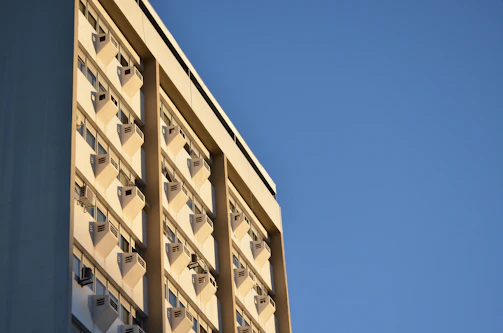 A commercial building rooftop with newly installed HVAC units shining under the sun.