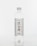 A clear plastic bottle filled with water, featuring a white label with black and red text and Asian characters. The bottle has a white cap and a simple, minimalist design, placed against a white background.