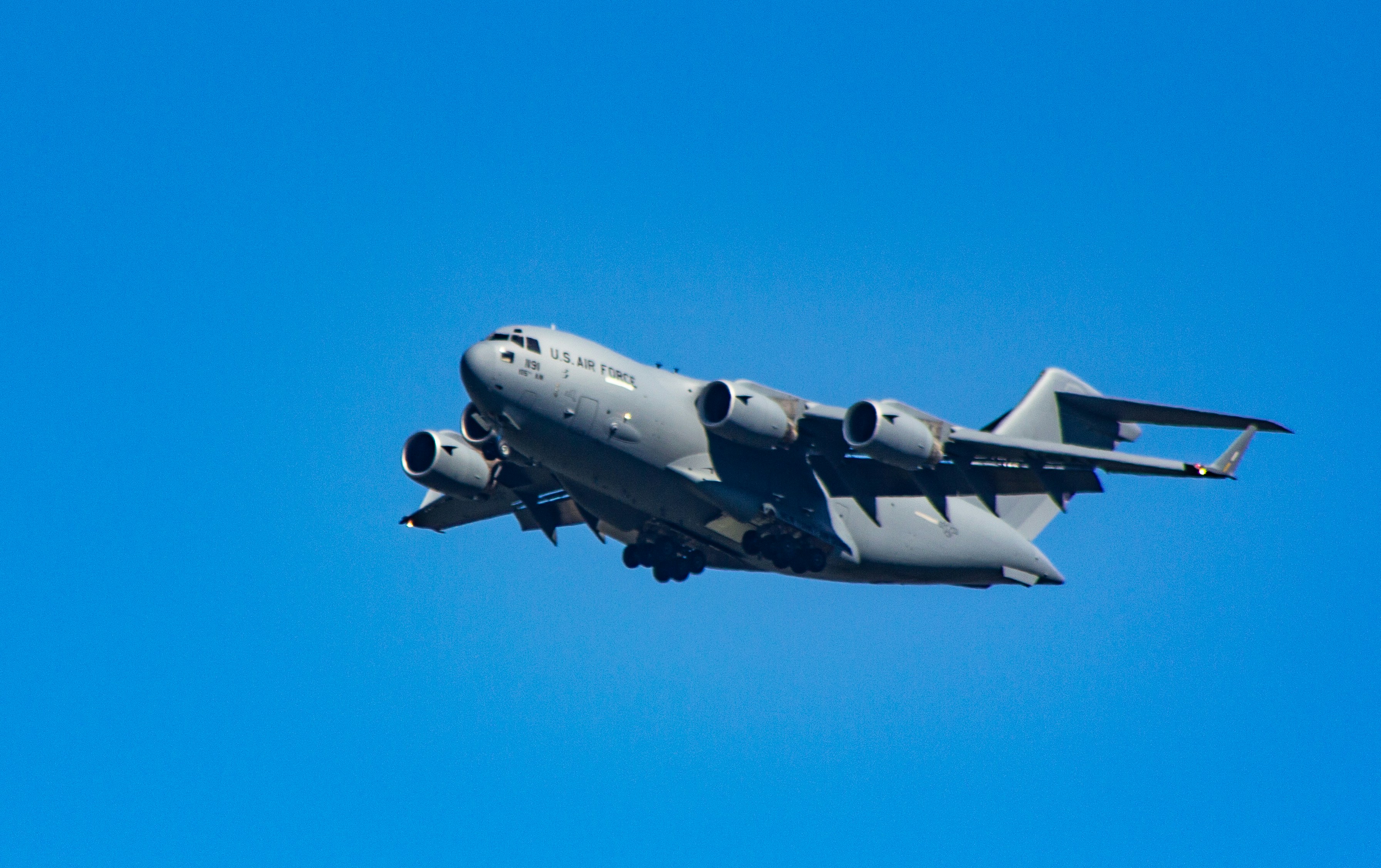 low-angle photography of gray passenger plane