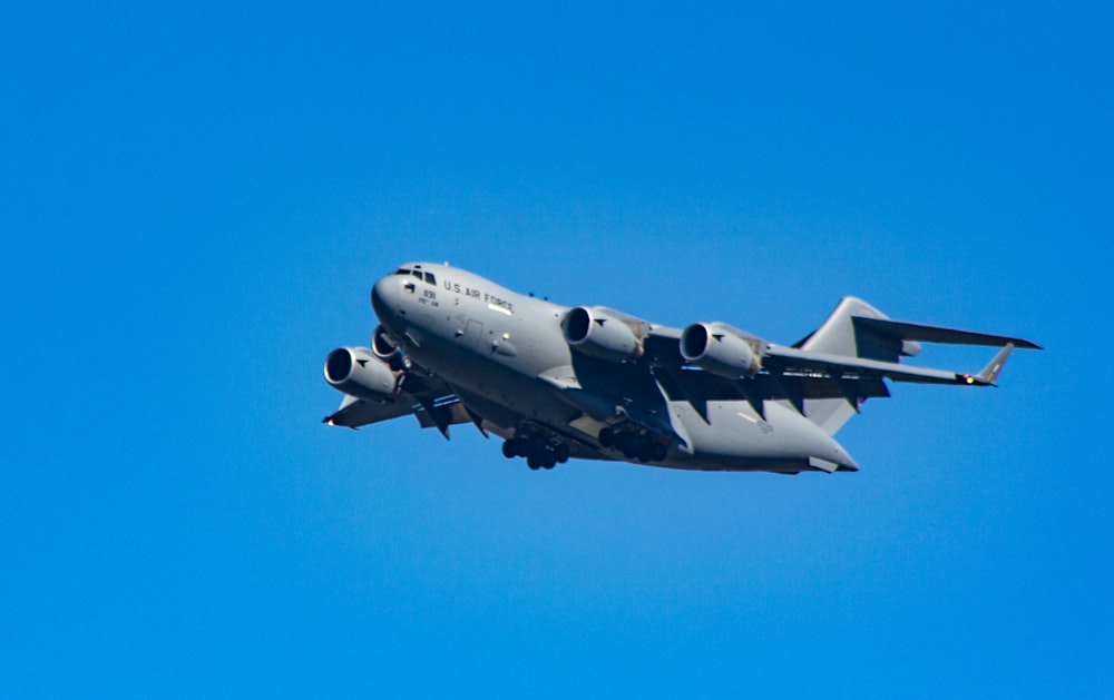 low-angle photography of gray passenger plane