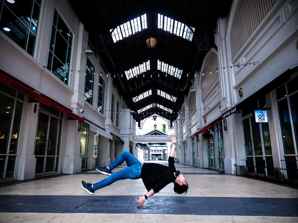 man flipping on hallway