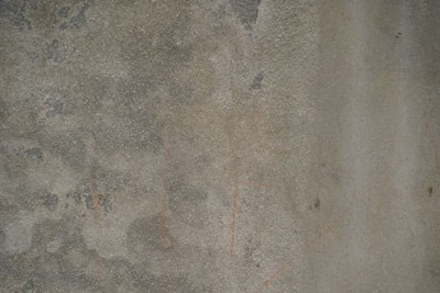 An image displaying the cleaning process of a concrete surface.