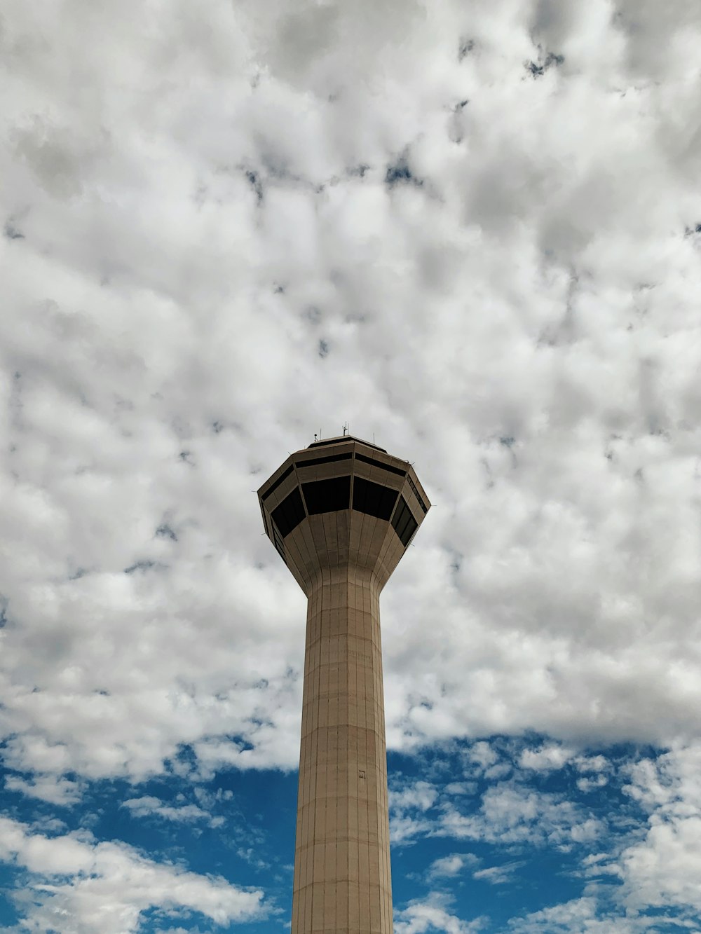 beige tower under white cloudy sky