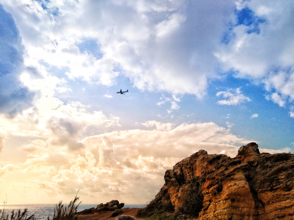 airplane under clouded sky