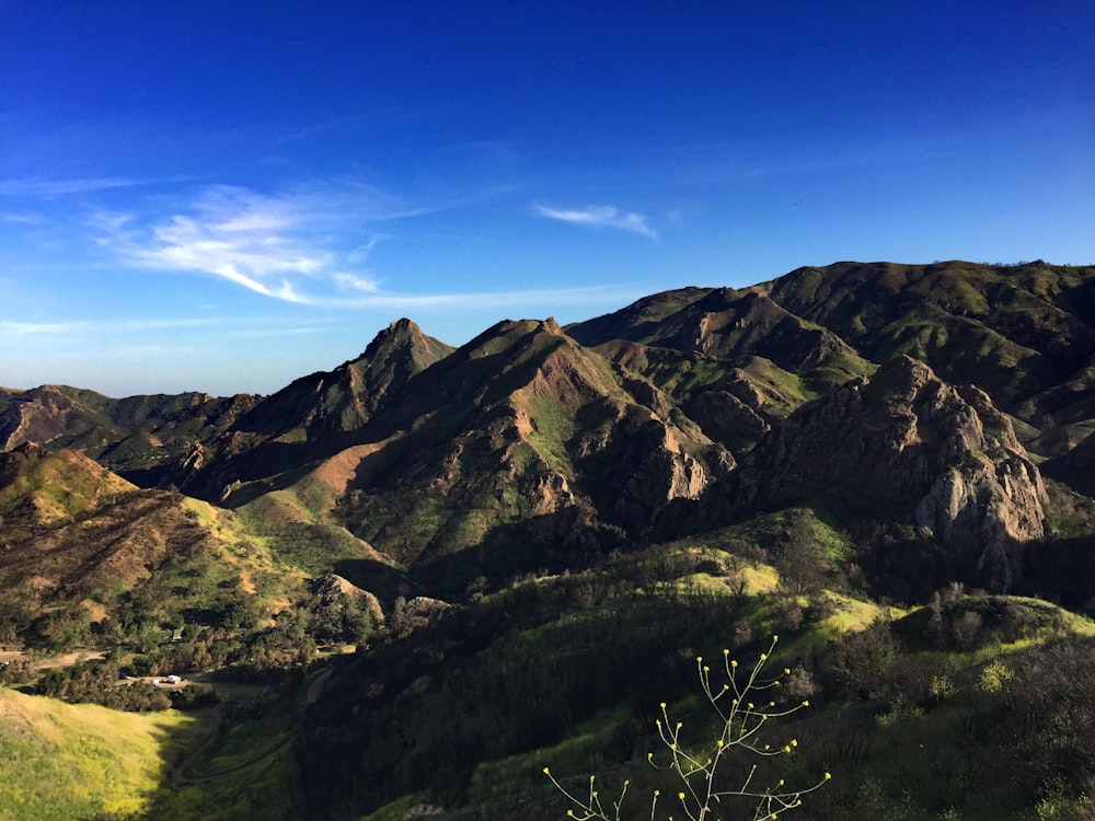 green and brown rolling hills