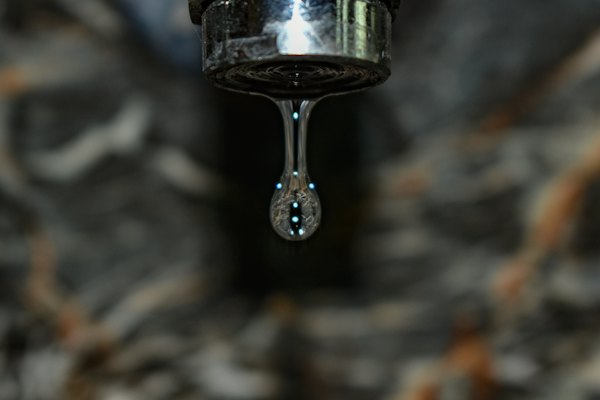 Water dripping from a worn tap