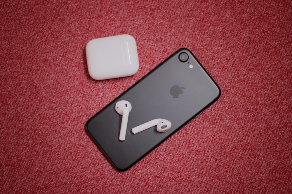 black iPhone 7 with AirPods